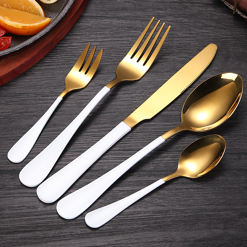 Elegant vintage stainless steel cutlery set with dessert spoon, fork, and knife

