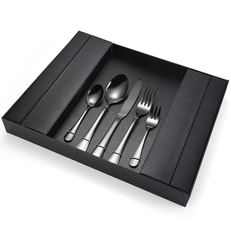 Elegant vintage stainless steel cutlery set with dessert spoon, fork, and knife

