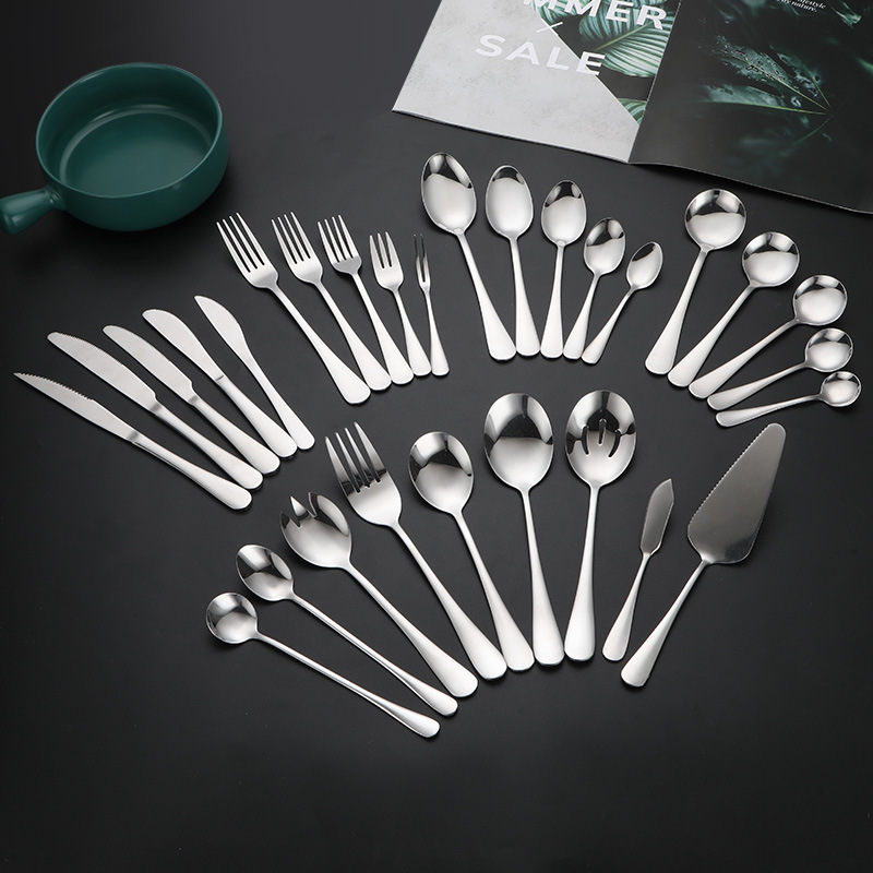 Elegant vintage stainless steel cutlery set with dessert spoon, fork, and knife

