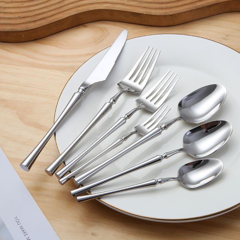 Gold stainless steel spoon and fork cutlery set for luxury restaurant table settings

