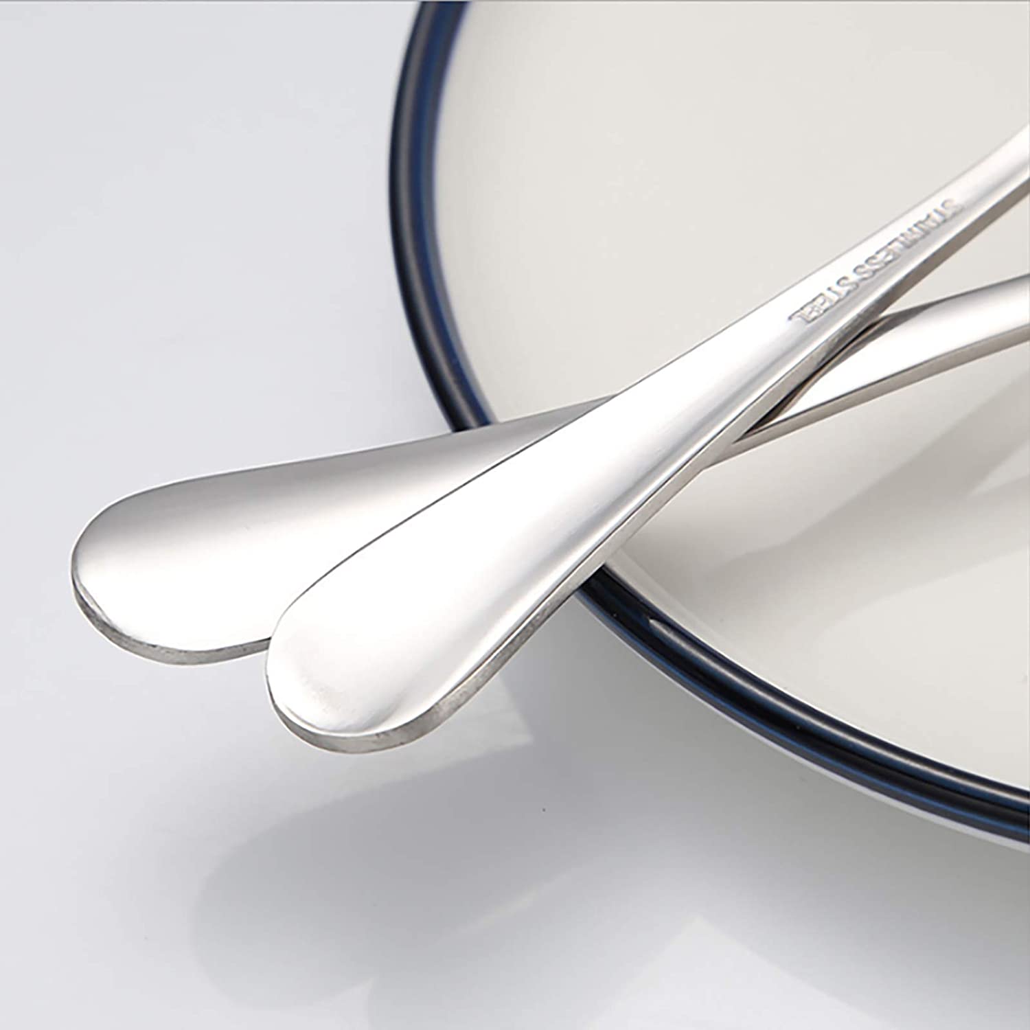 Stainless steel serving cutlery set including service knife, spoon, and fork

