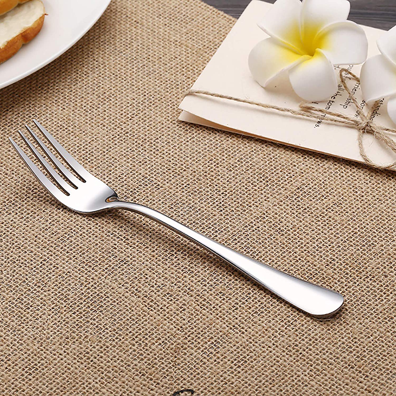 Stainless steel serving cutlery set including service knife, spoon, and fork

