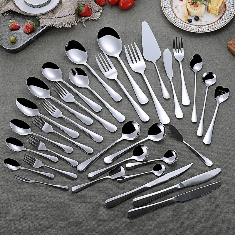Stainless steel serving cutlery set including service knife, spoon, and fork

