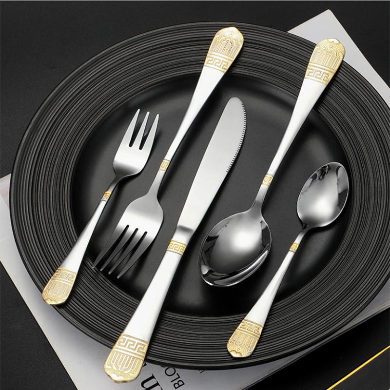 Colorful stainless steel cutlery set with padded handles and modern design

