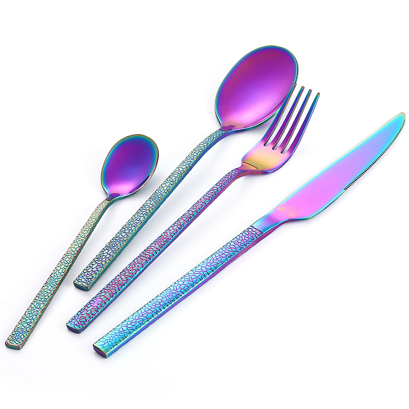 Colorful stainless steel cutlery set with padded handles and modern design

