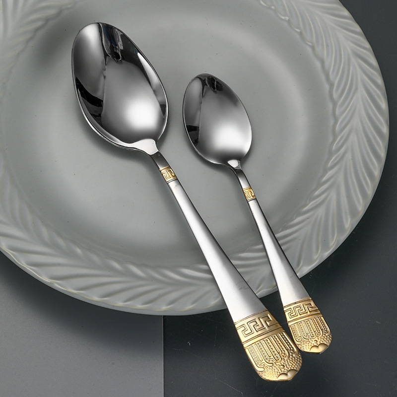 Colorful stainless steel cutlery set with padded handles and modern design

