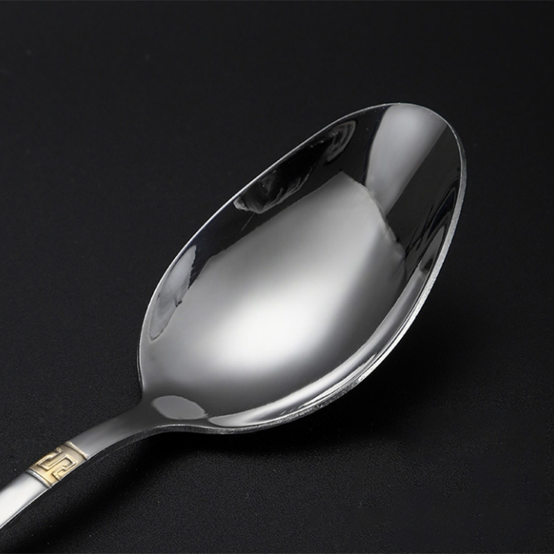 Colorful stainless steel cutlery set with padded handles and modern design

