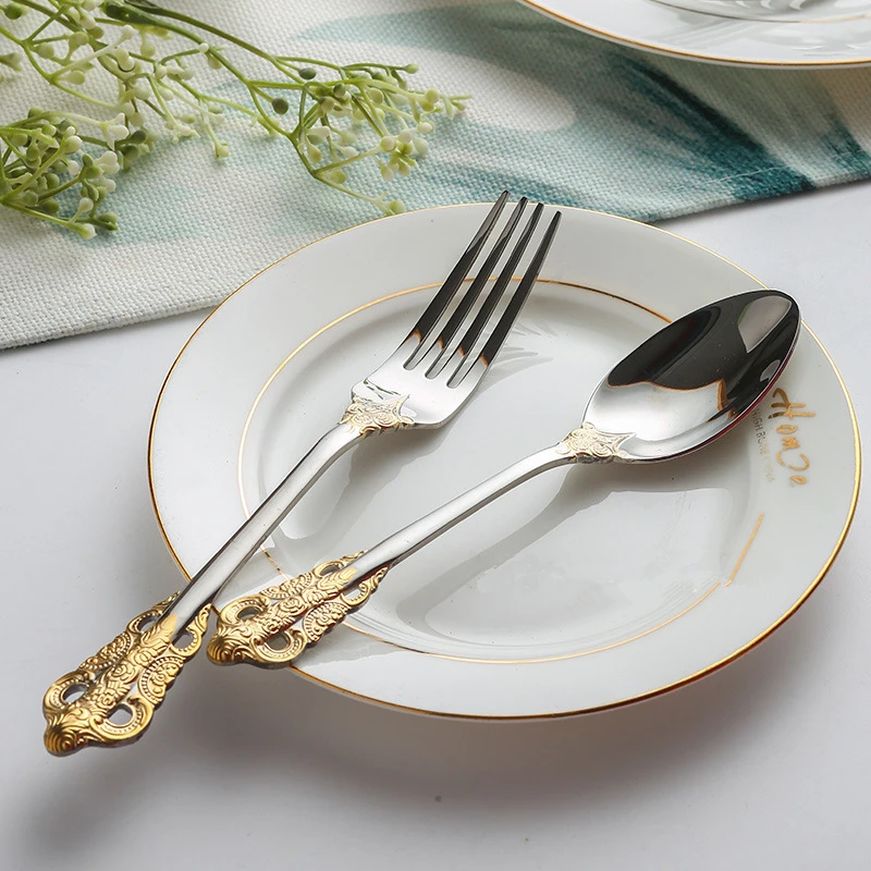 Stainless steel kitchen cutlery set including knife, fork, and spoon