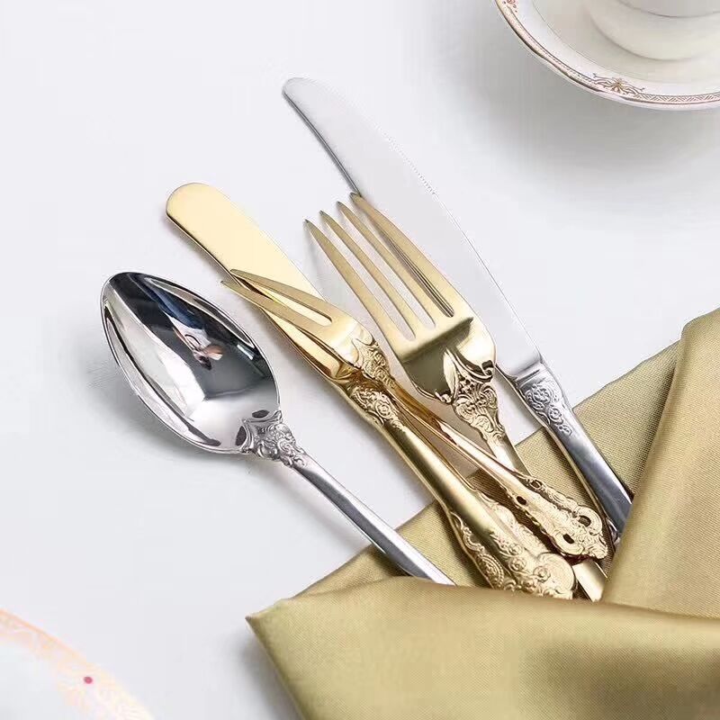 Stainless steel kitchen cutlery set including knife, fork, and spoon
