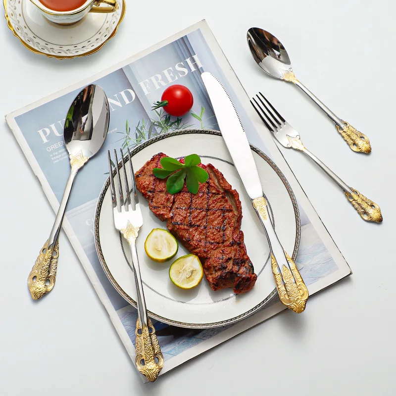 Stainless steel kitchen cutlery set including knife, fork, and spoon