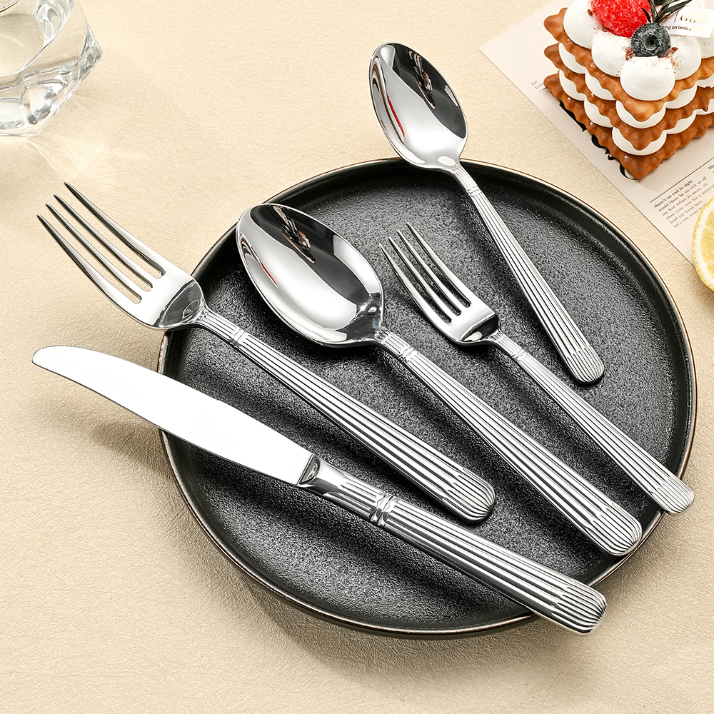 Stainless steel cutlery set including knife, fork, and spoon

