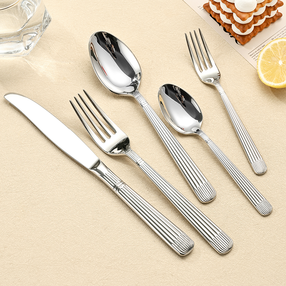 Stainless steel cutlery set including knife, fork, and spoon

