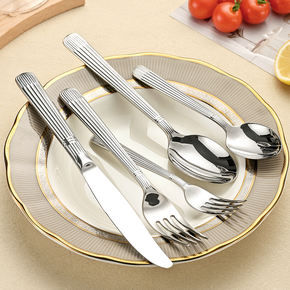 Stainless steel cutlery set including knife, fork, and spoon

