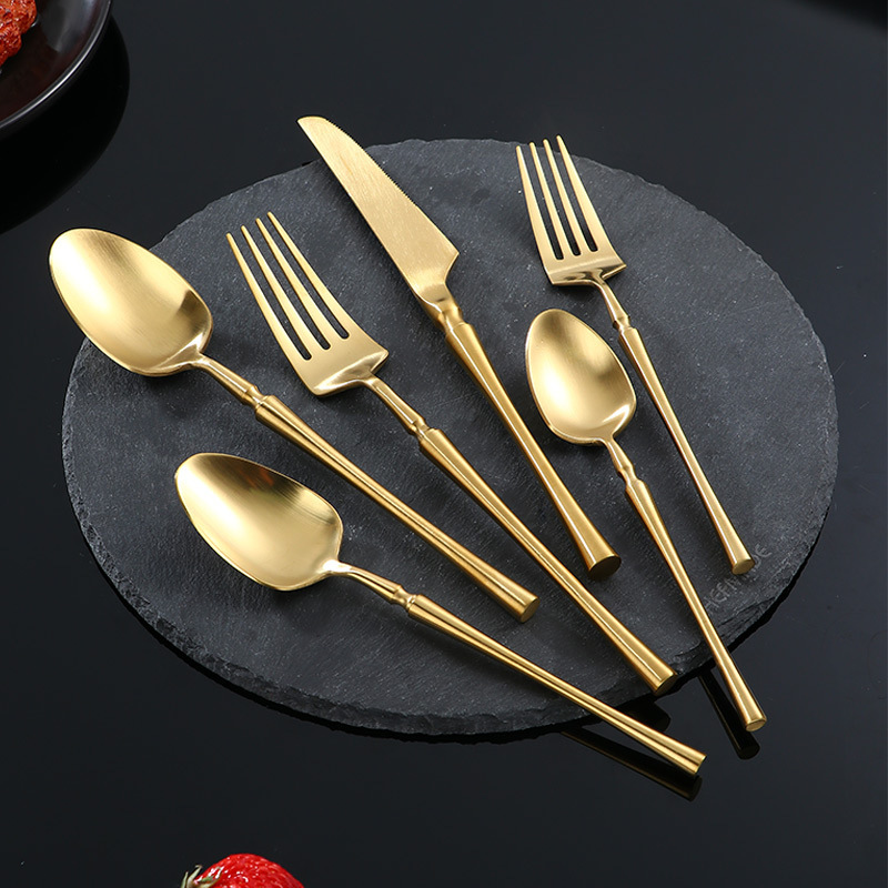 Reusable gold stainless steel cutlery set with elegant modern design

