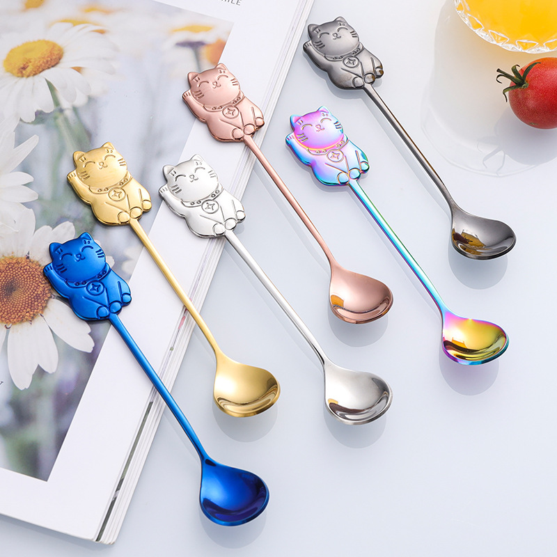 Gold stainless steel wedding cutlery set with fork, knife, and spoon

