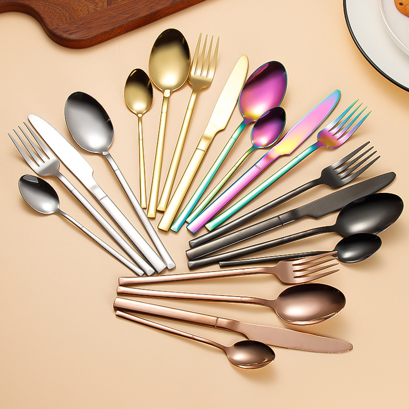 Modern stainless steel cutlery set with wooden handles for elegant dining

