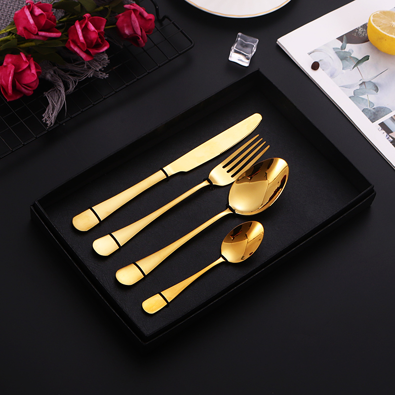 S-shaped stainless steel flatware set with knife, fork, and spoon

