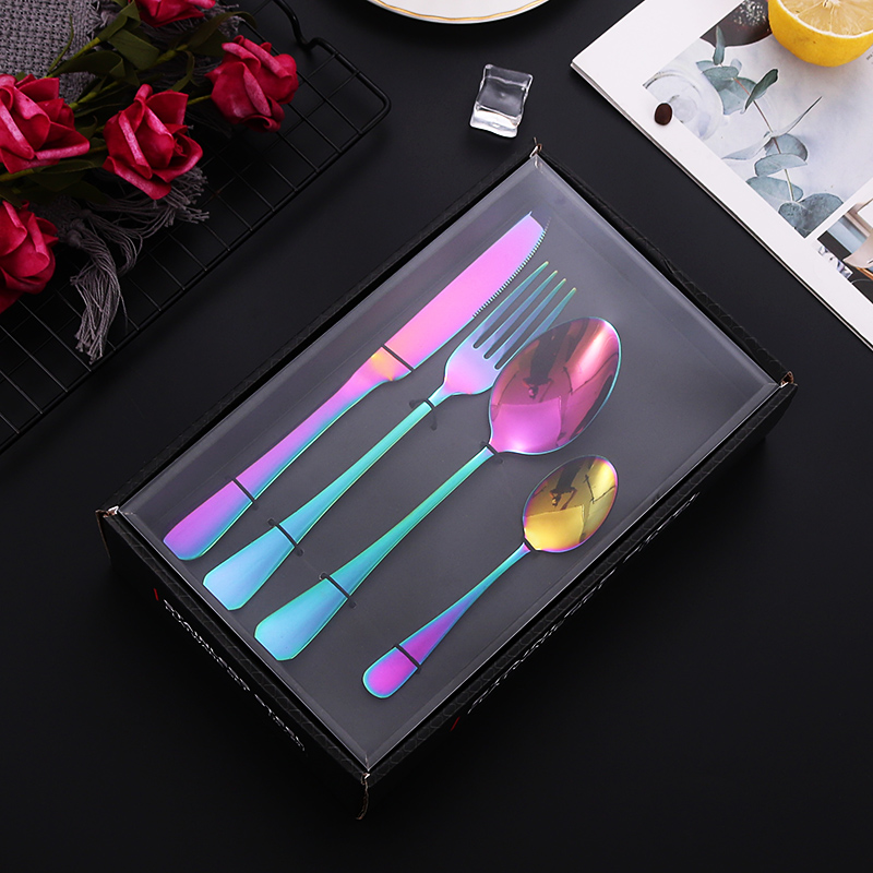 S-shaped stainless steel flatware set with knife, fork, and spoon

