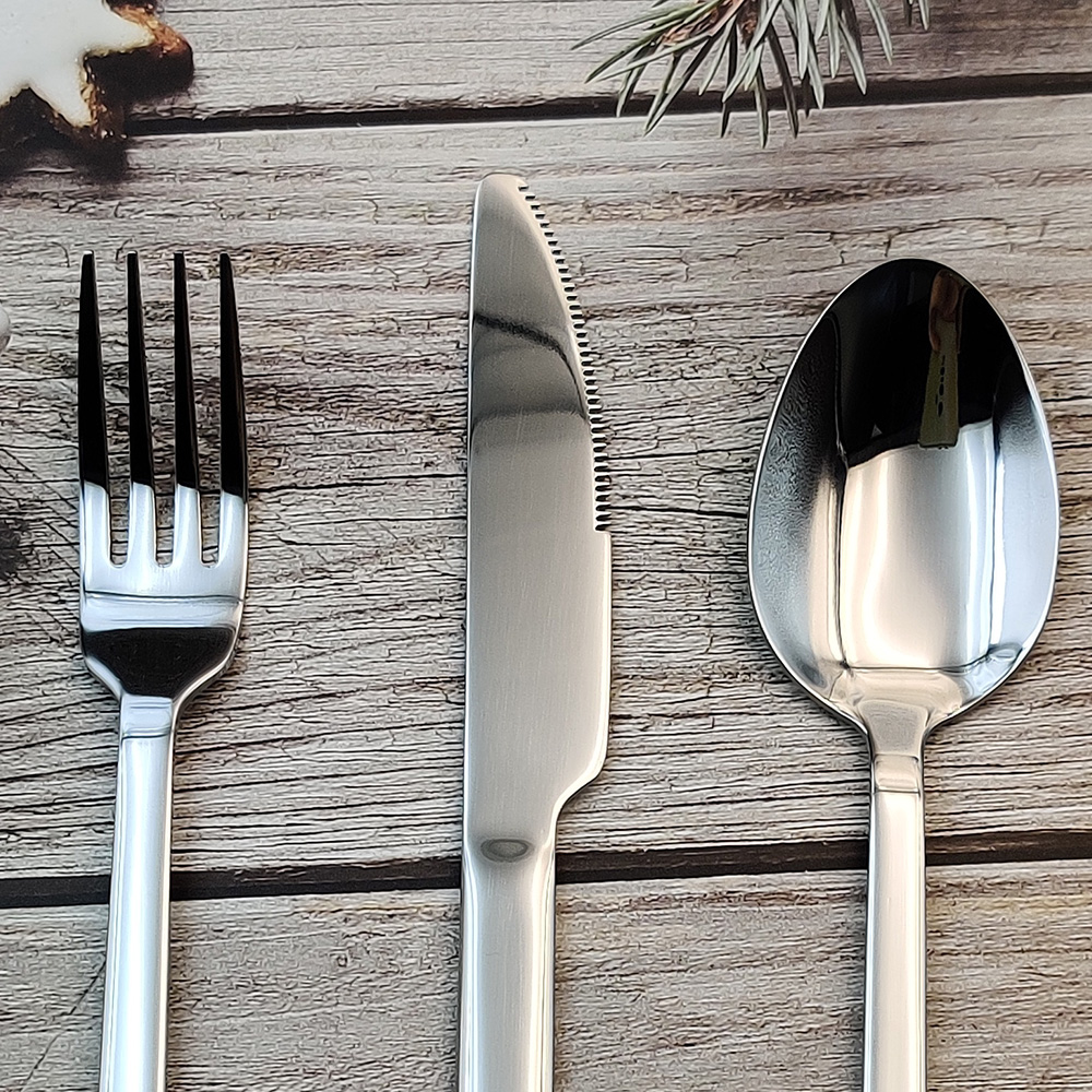 S-shaped stainless steel flatware set with knife, fork, and spoon

