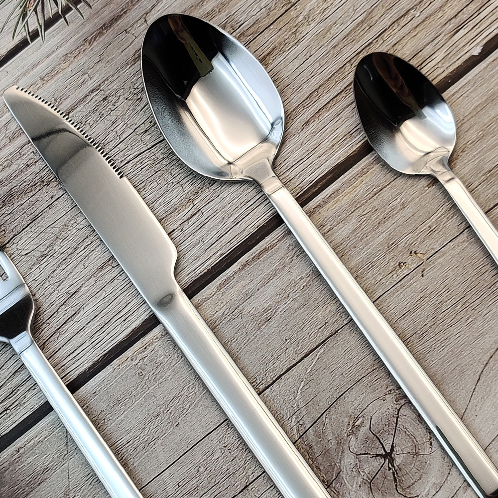 S-shaped stainless steel flatware set with knife, fork, and spoon

