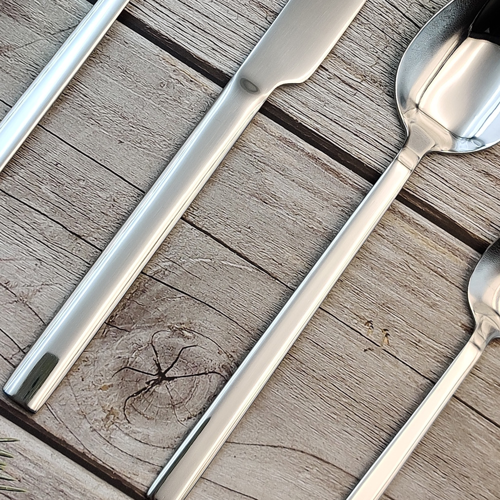 S-shaped stainless steel flatware set with knife, fork, and spoon


