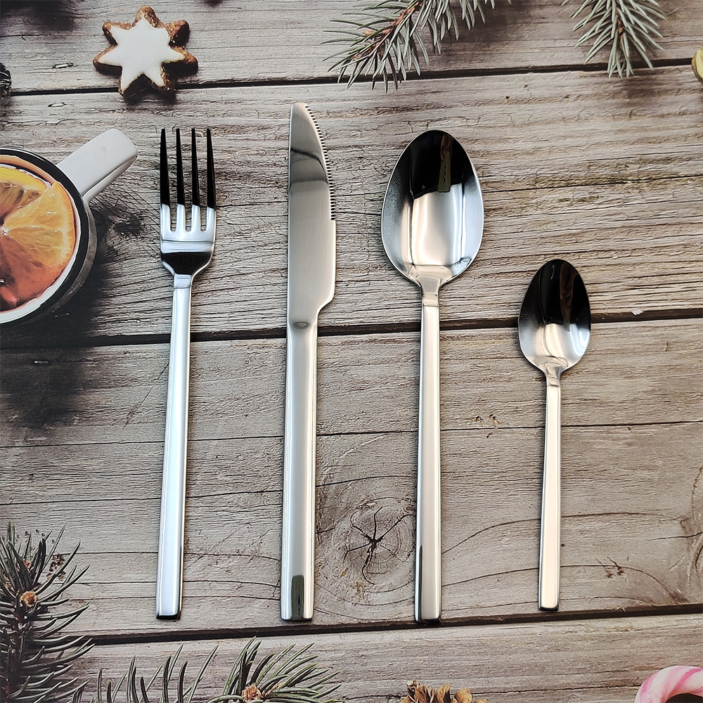 S-shaped stainless steel flatware set with knife, fork, and spoon

