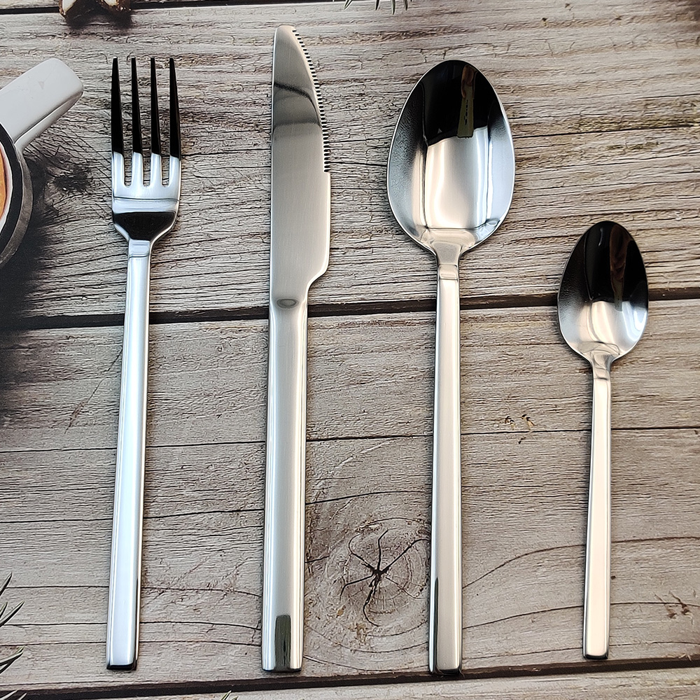 S-shaped stainless steel flatware set with knife, fork, and spoon

