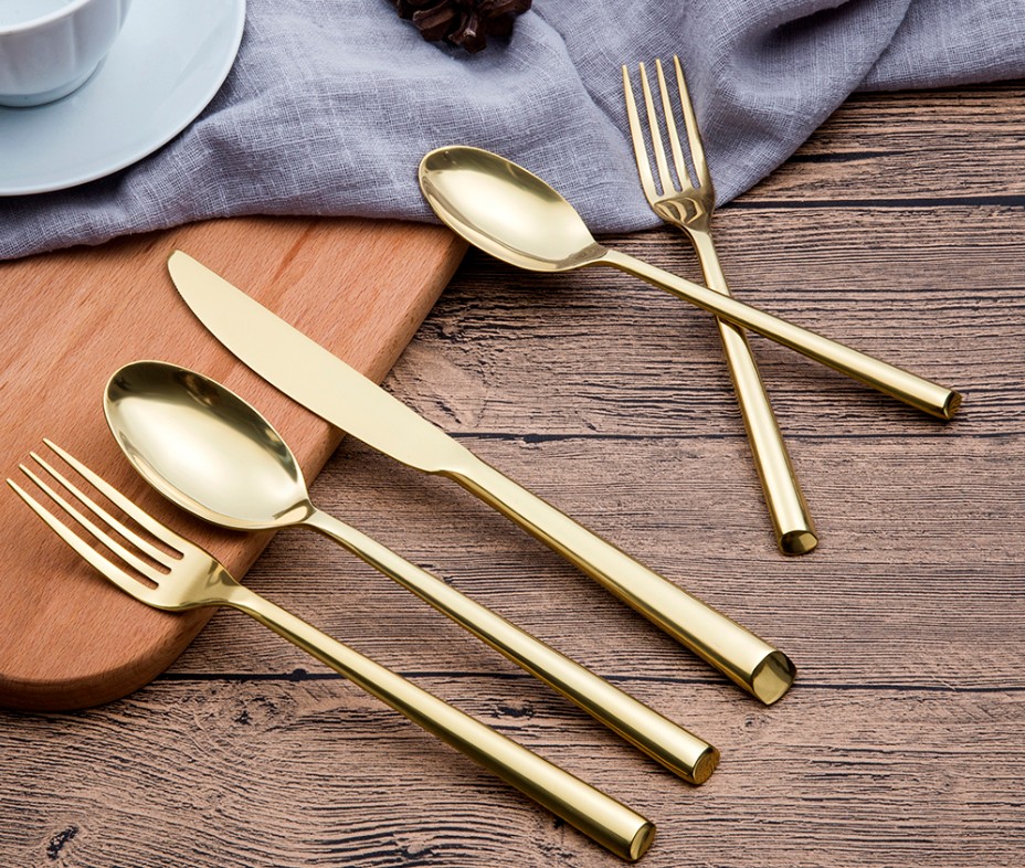 Stainless steel kitchen cutlery set including fork, spoon, and knife

