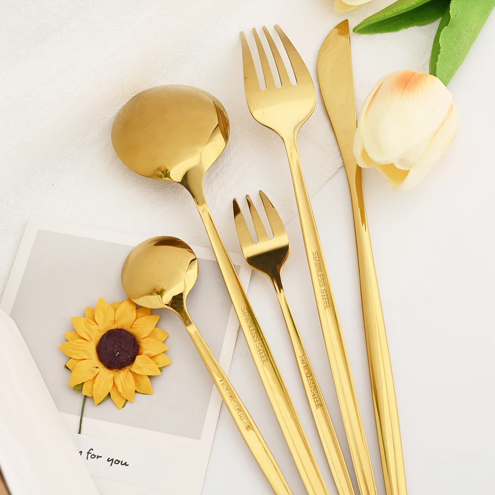 Stainless steel kitchen cutlery set including fork, spoon, and knife

