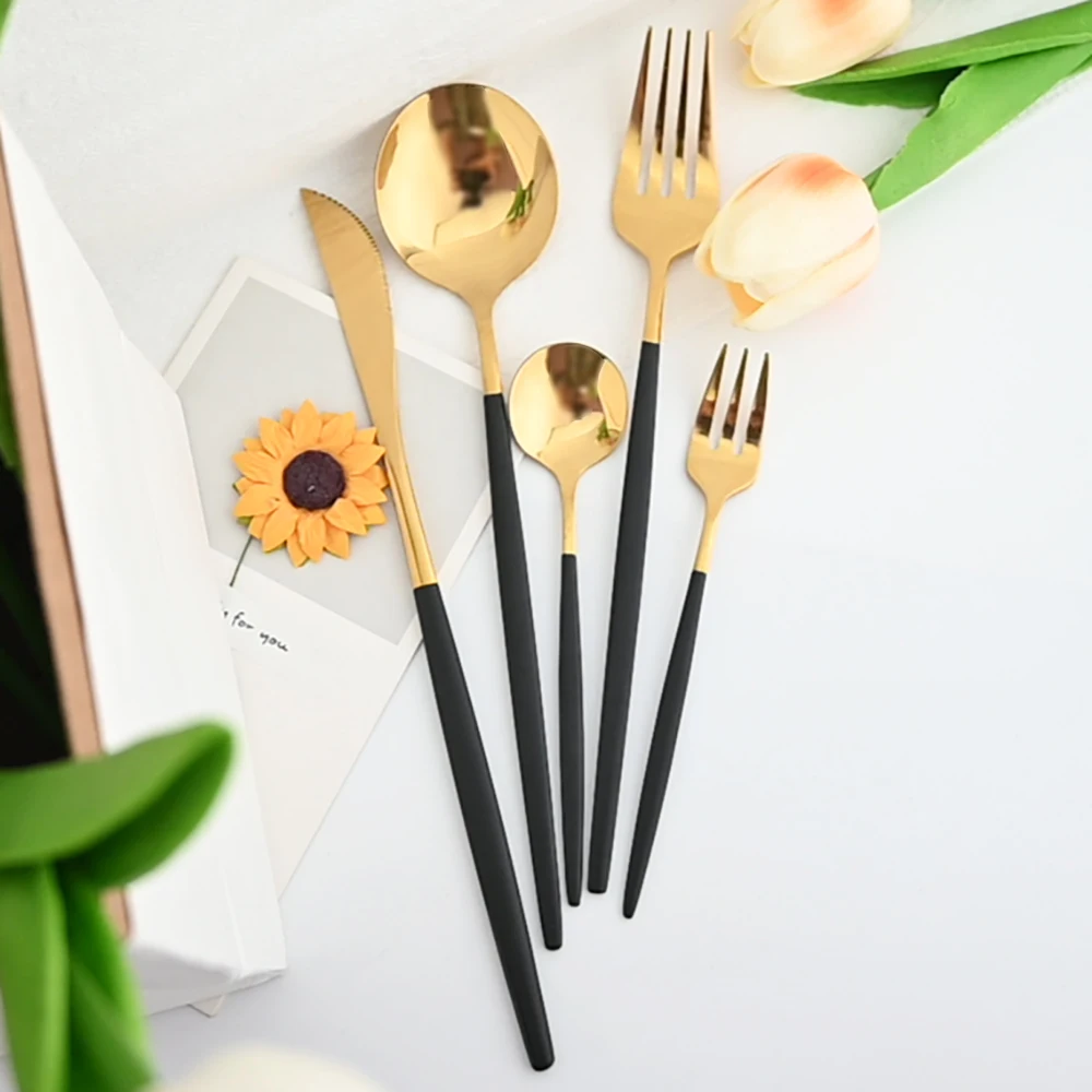 Stainless steel kitchen cutlery set including fork, spoon, and knife


